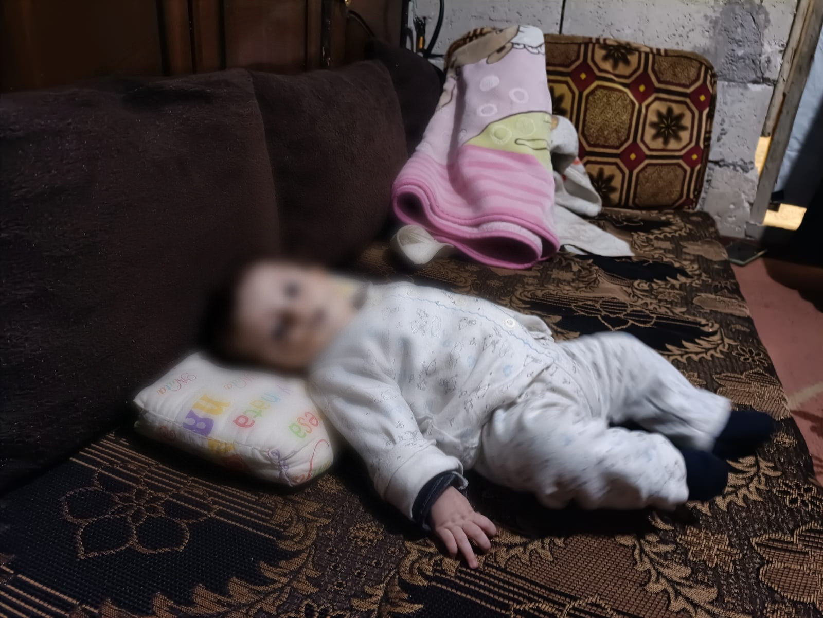 An infant needs help to secure milk