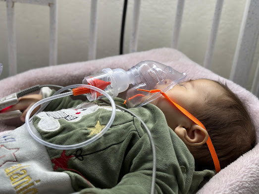 A child is struggling to stay alive and his father sold everything he has to save him.