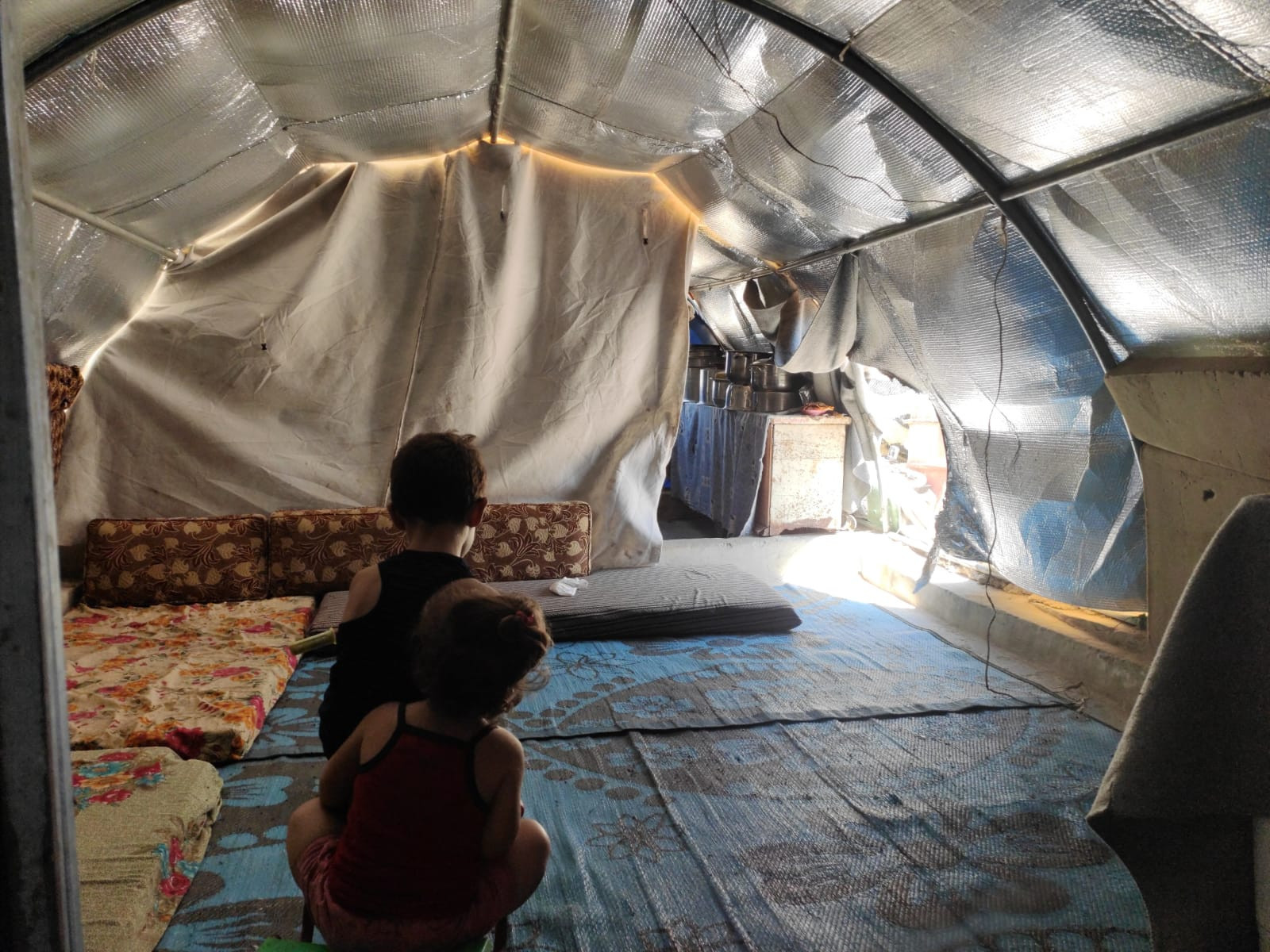 Their tent got burnt and needs help to rebuild it