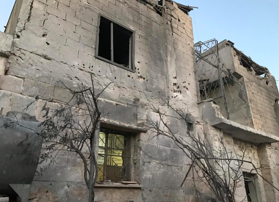 A family needs to repair their house after the bombardment