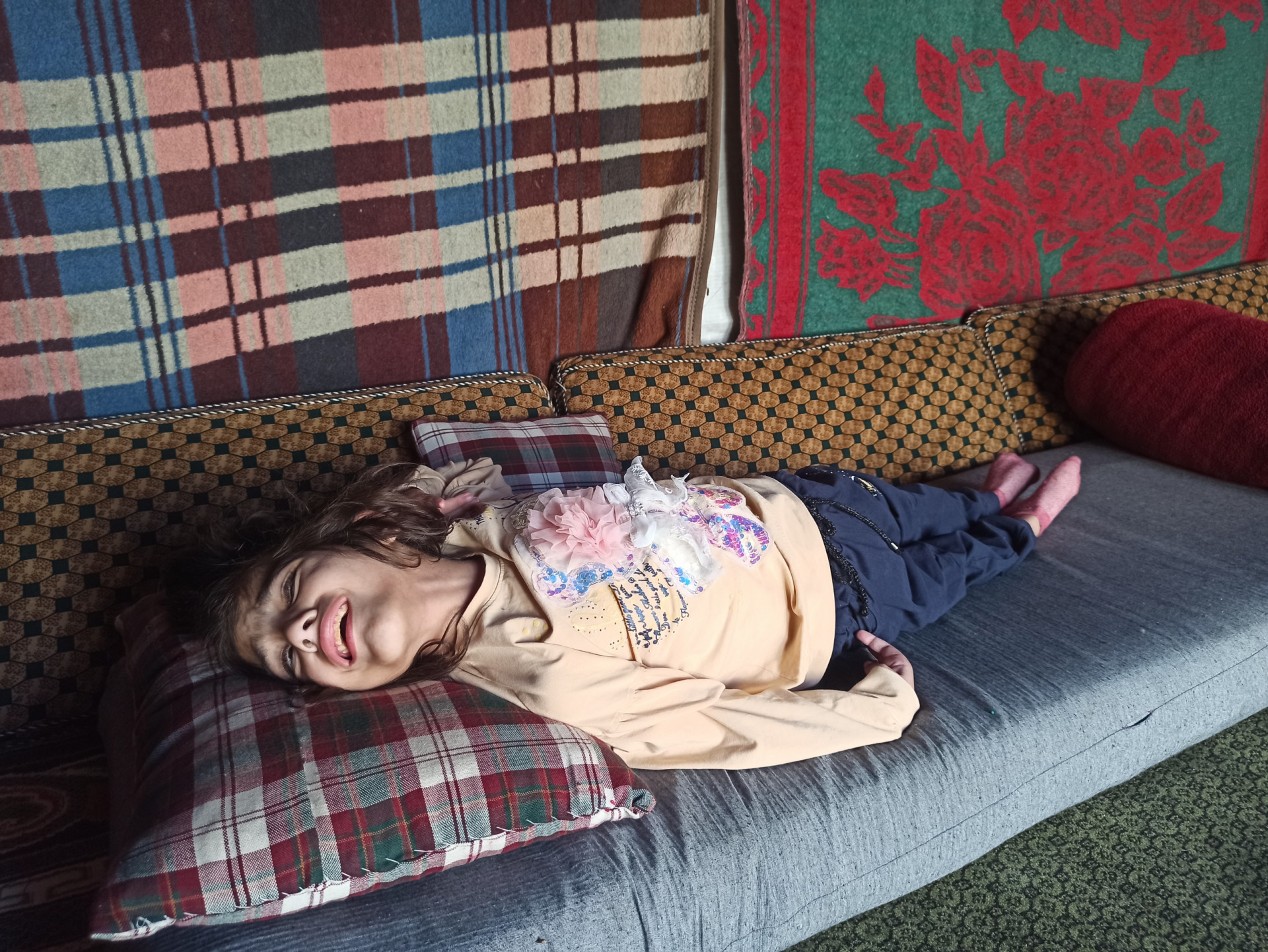 A child with cerebral palsy in need of help