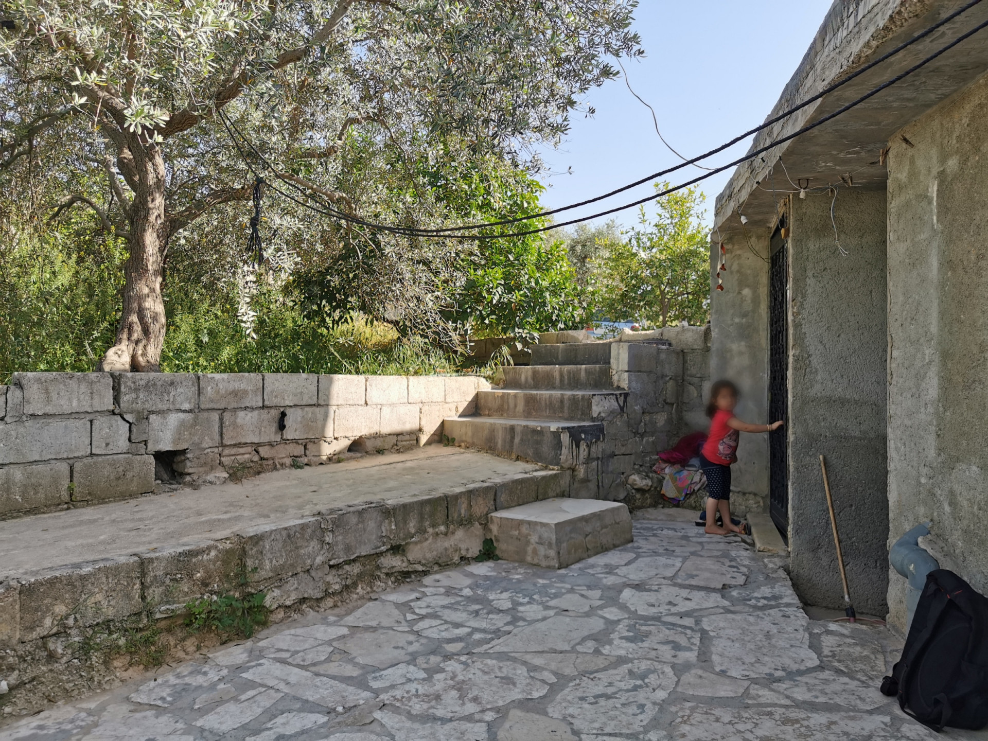 Two families live in poor conditions , at risk of being homeless