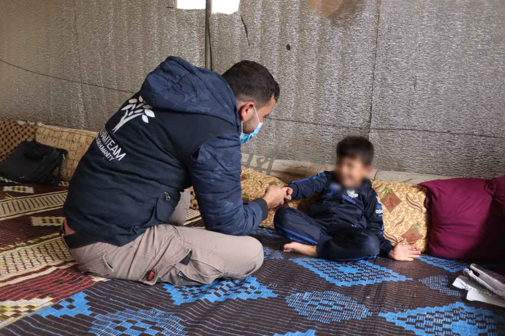 A family living in a small tent that lacks basic life needs.