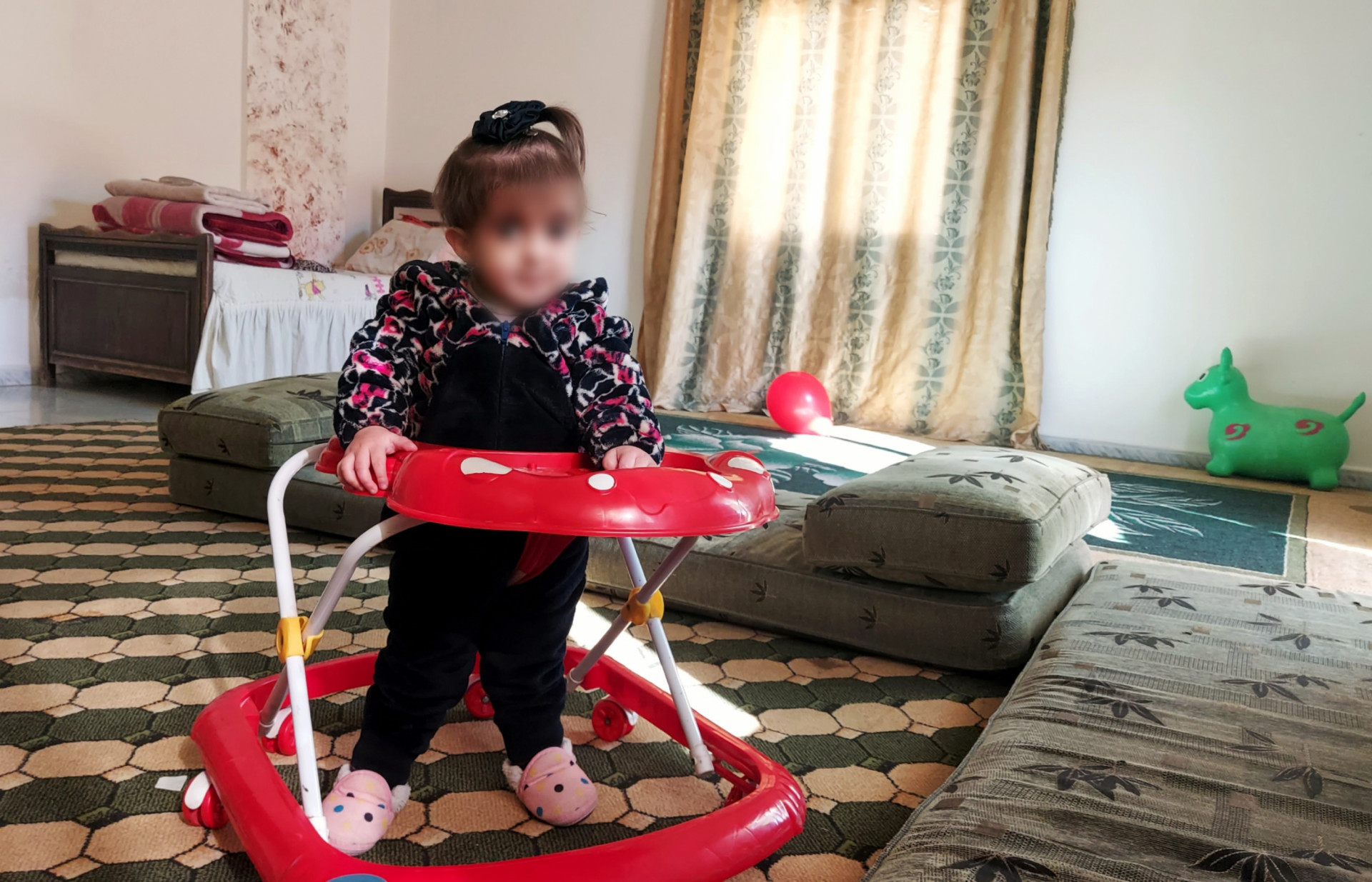 Layan is a girl with heart congenital defect and cerebral atrophy