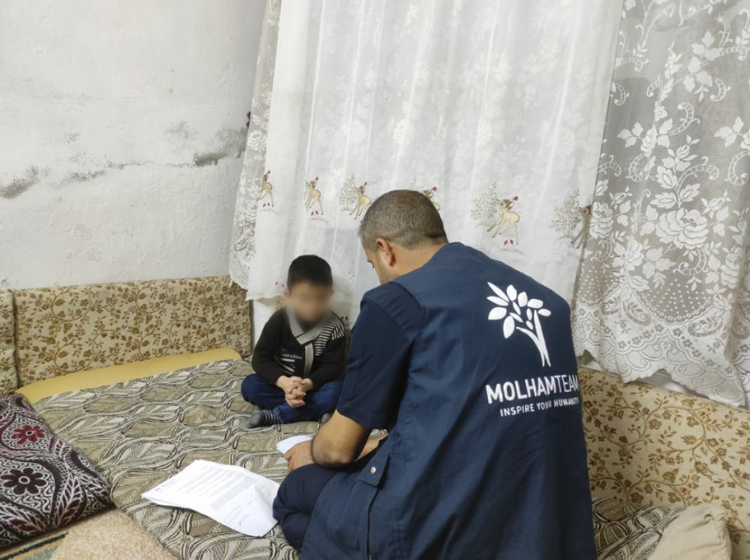 His hearing was damaged by shelling, a kid needs hearing aids.