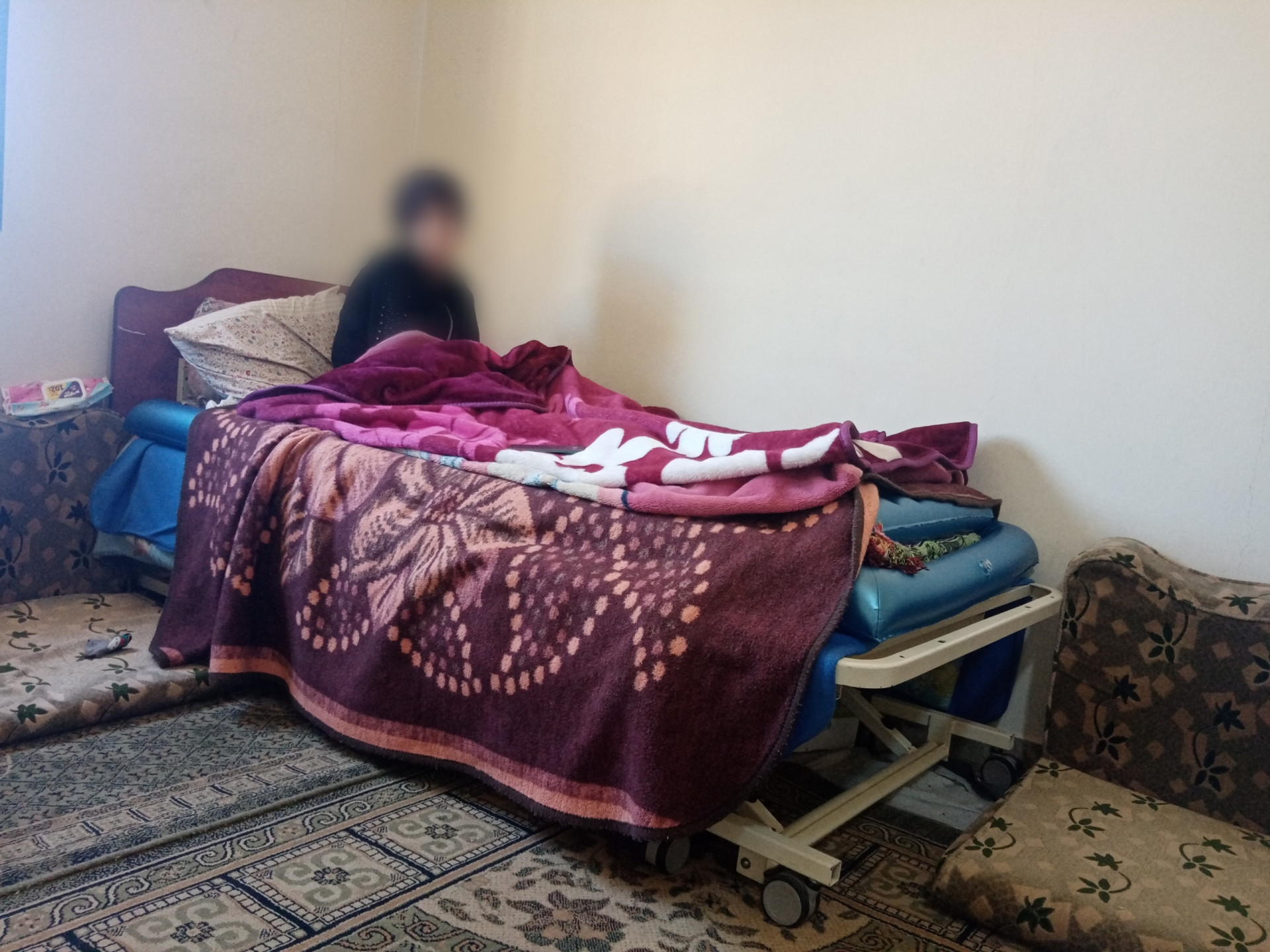 Thana' is bedridden and needs help