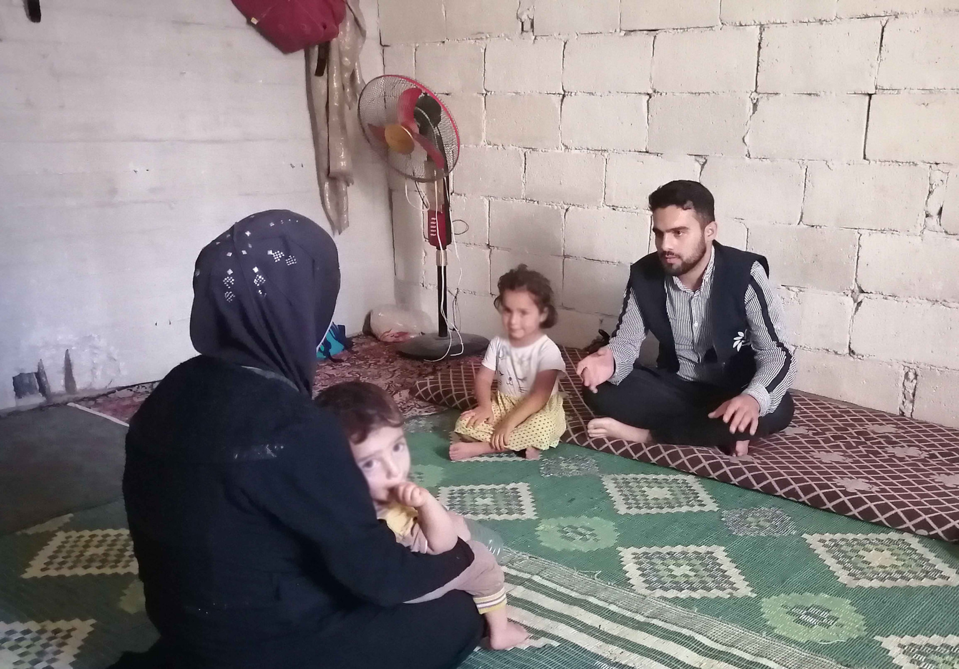 A sick woman with her disabled husband in need for help