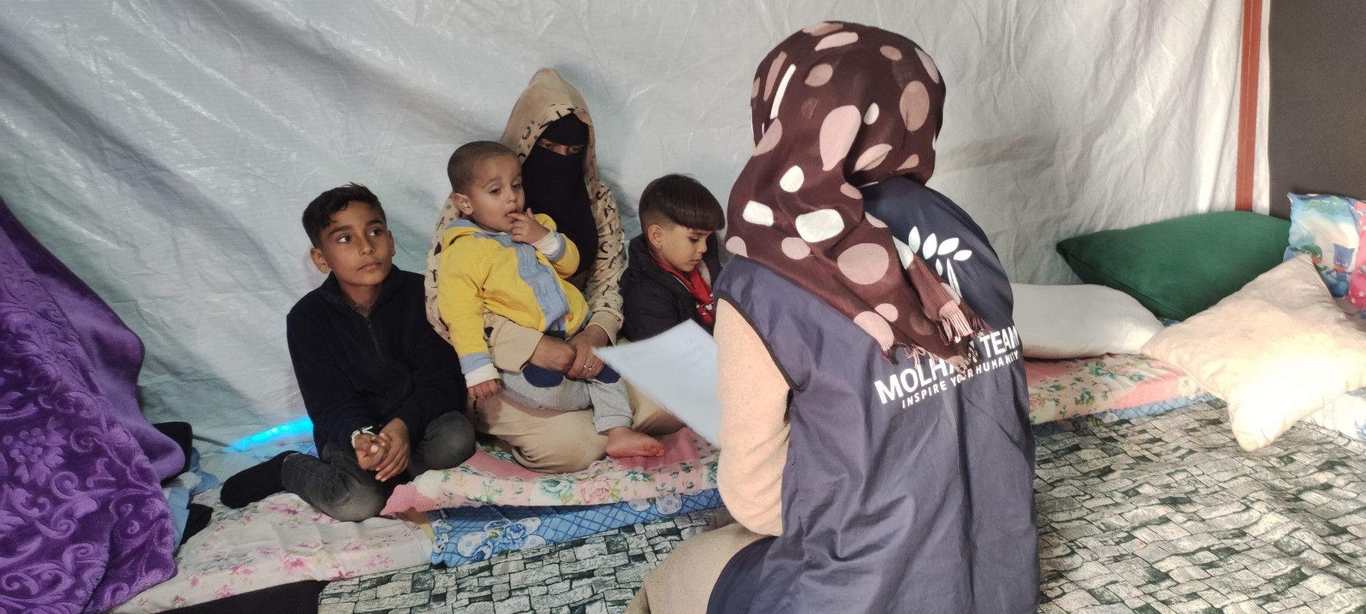 This family lives in a tent after their house was damaged by the earthquake