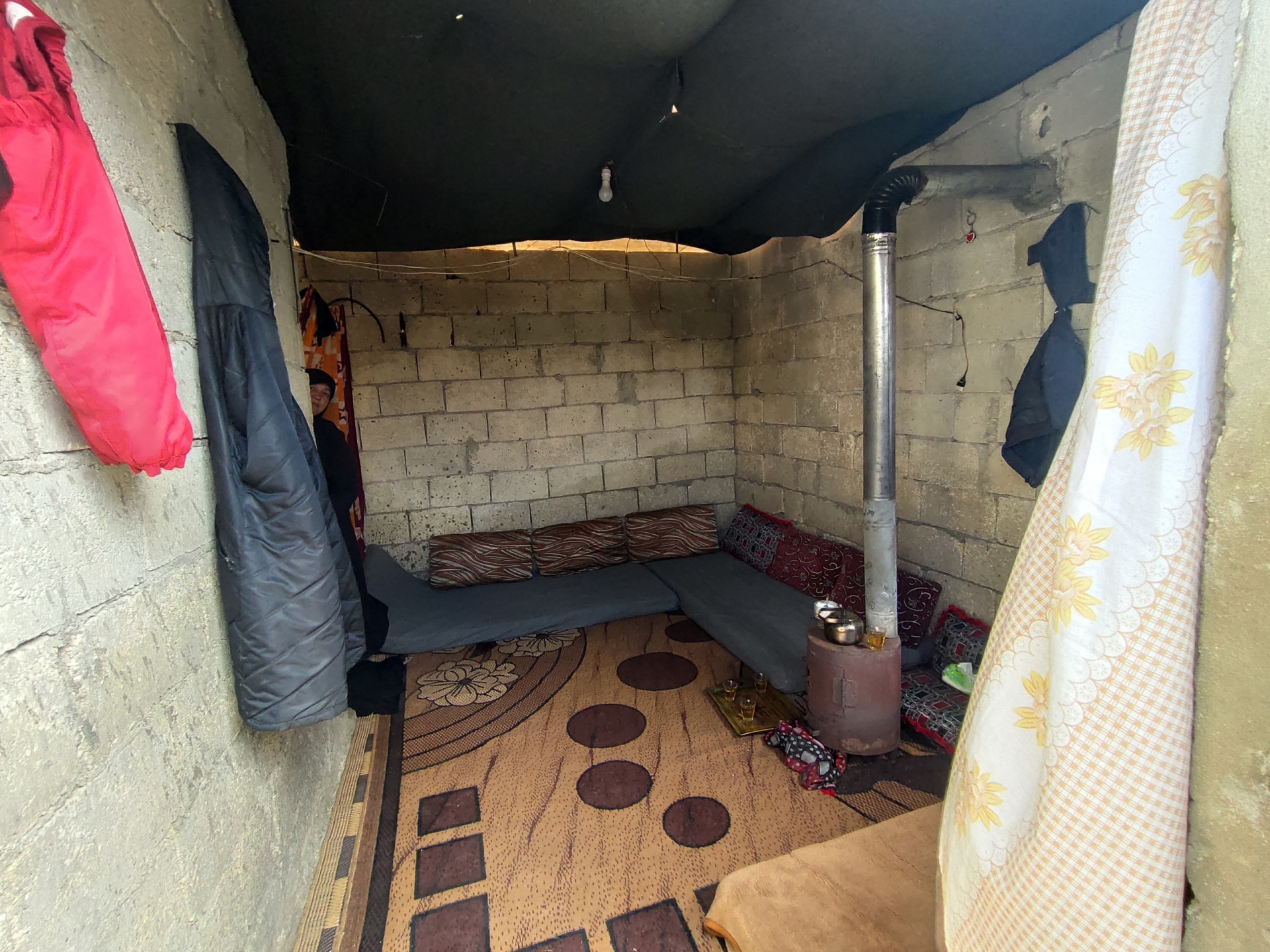 Maha lives alone in a worn-out tent without a breadwinner