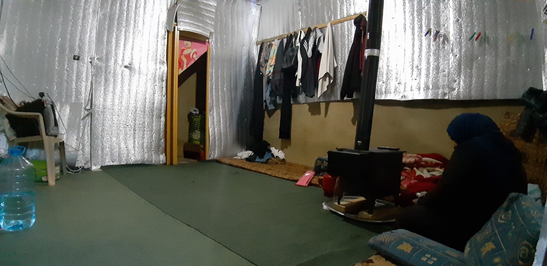A mother lives alone with her son in a camp