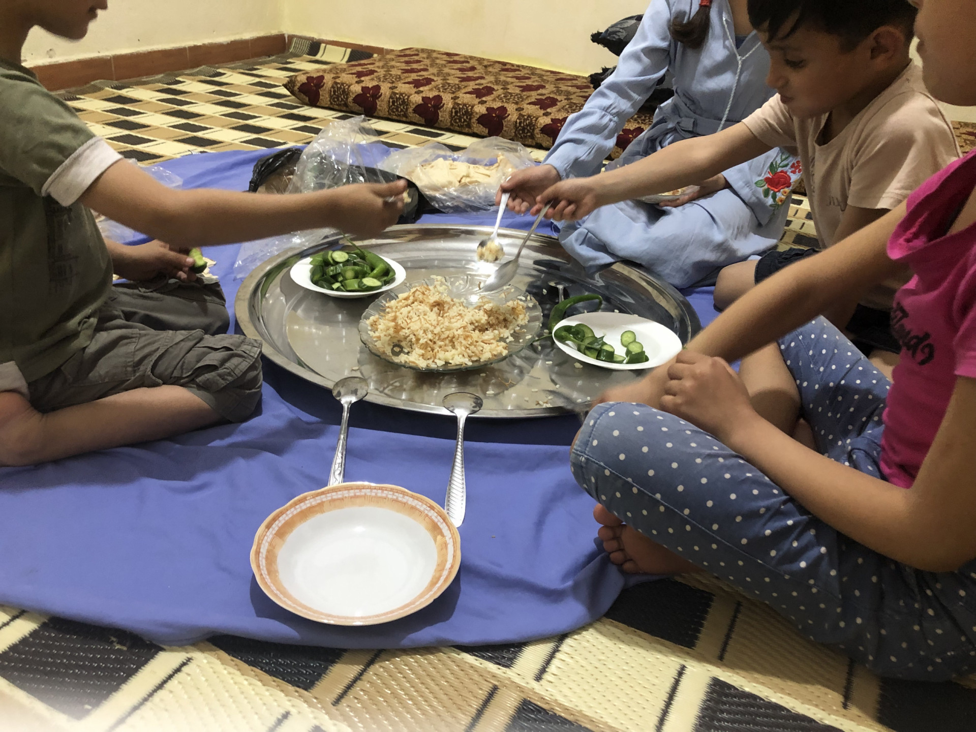A family burdened by accumulated debt and living in harsh conditions.