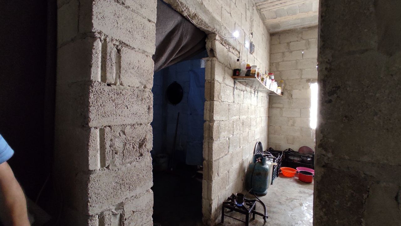 A family lives in an unfinished house